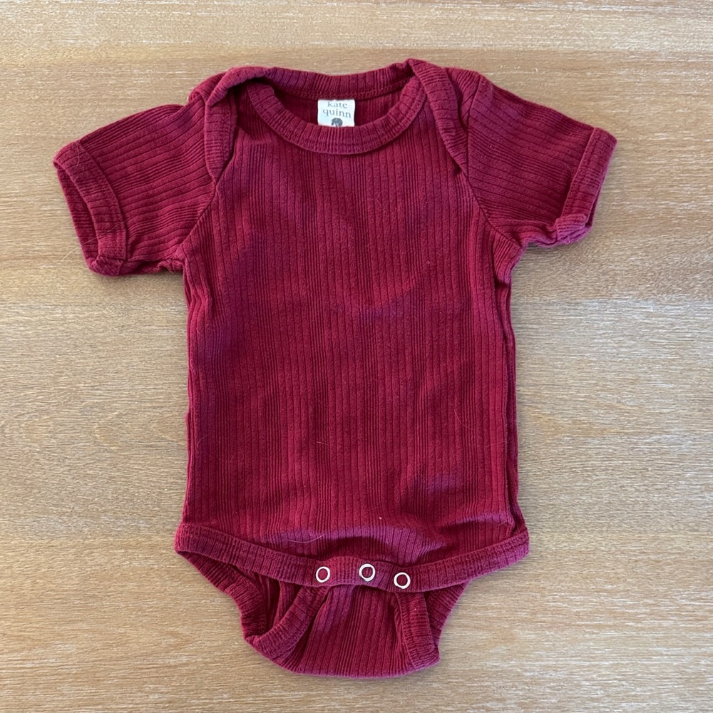 kate quinn Ribbed Baby Onesie